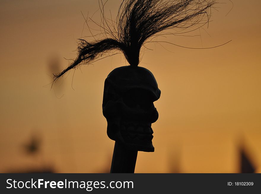 Shrunken African head at sunset. Shrunken African head at sunset