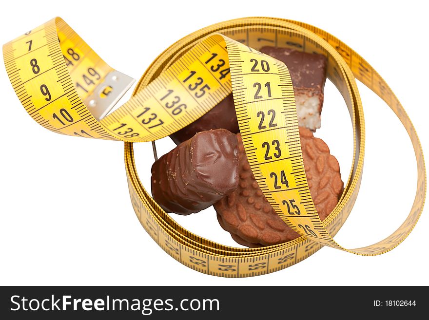 Centimeter with sweets and cookies close up on a white background