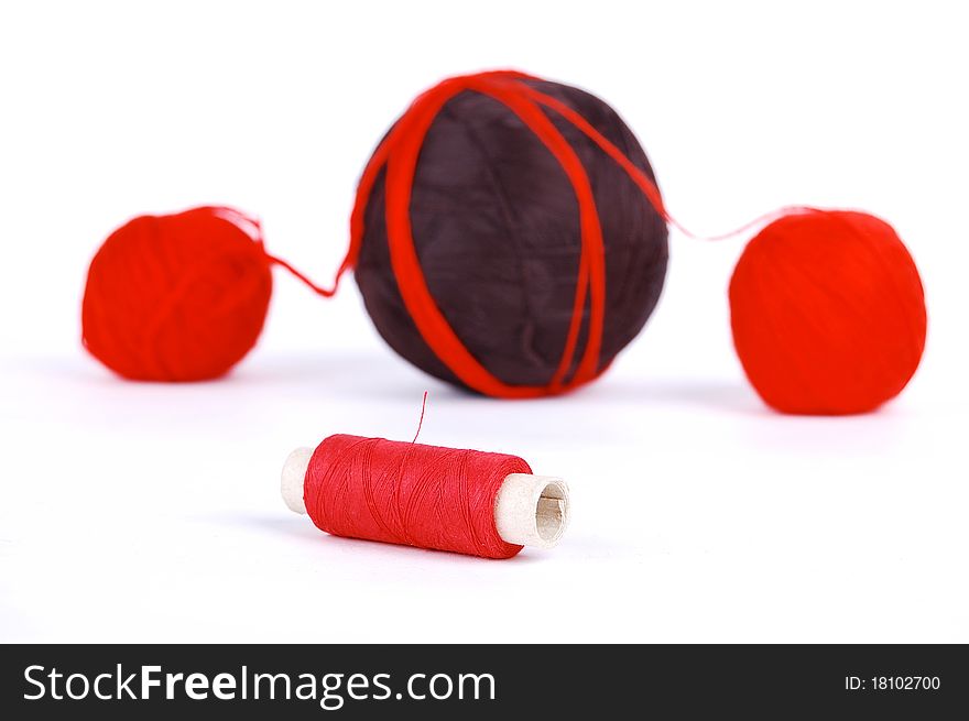 Red and brown balls on a white background