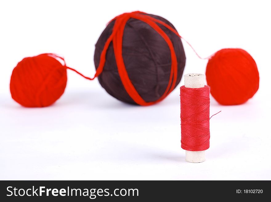 Red and brown balls on a white background