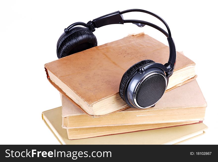 Books in headsets on a white background