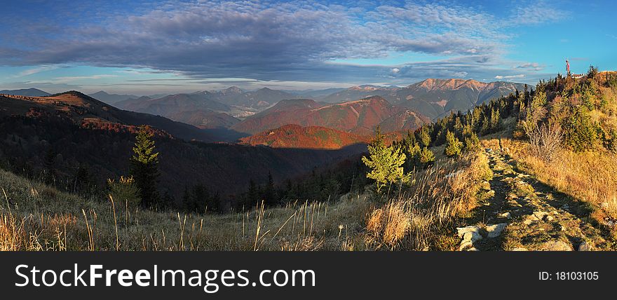 The mountain autumn landscape with colorful forest