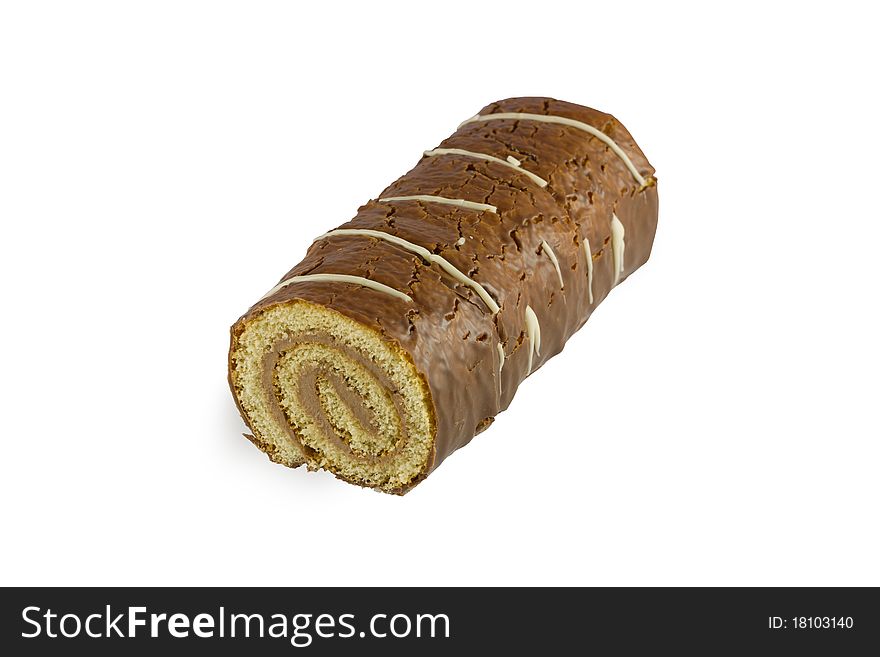 Swiss roll covered with milk chocolate isolated on white