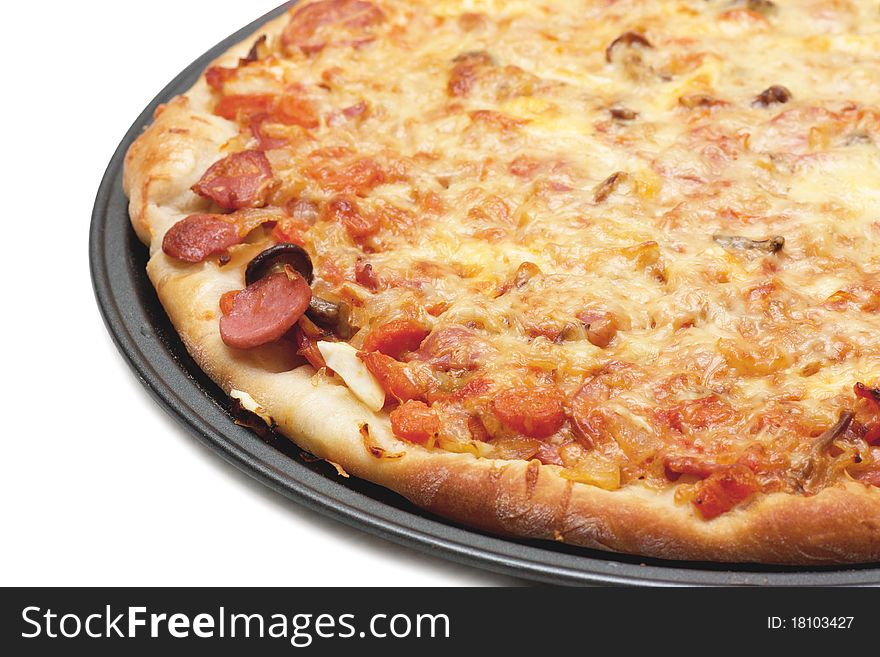 Hot fresh pizza on a baking tray isolated