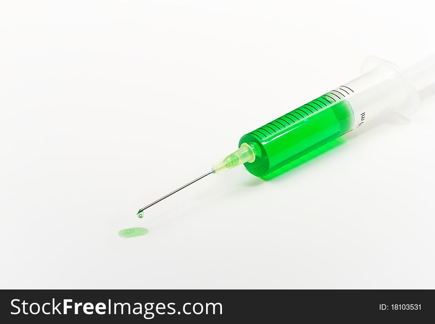 A medical needle with a drop on the tip. A medical needle with a drop on the tip