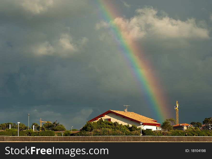 Rainbow above a house after the rain