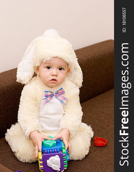 Pretty Caucasian Baby In Rabbit Costume Playing