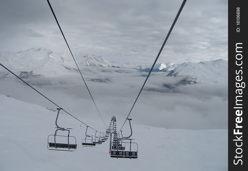 Chair lift and mountains in winter, Savoy alps, Les Karellis, France