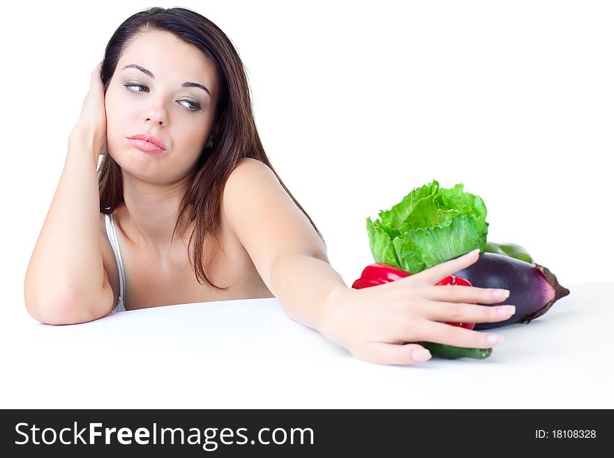 Young girl with vegetables over white background. Young girl with vegetables over white background
