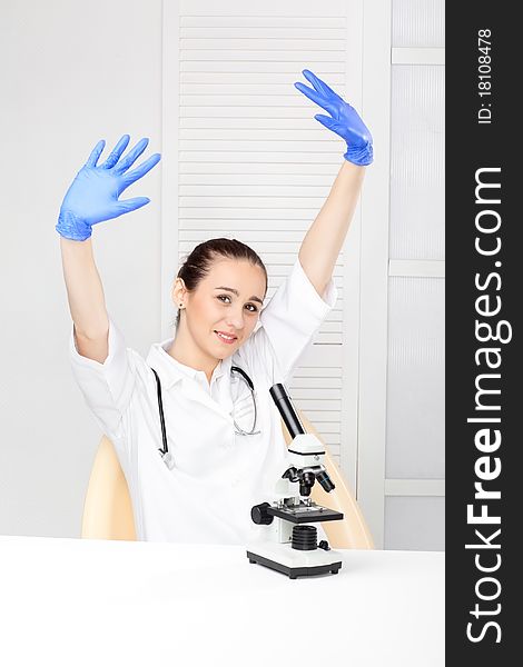 Medical - Female nurse looking in microscope