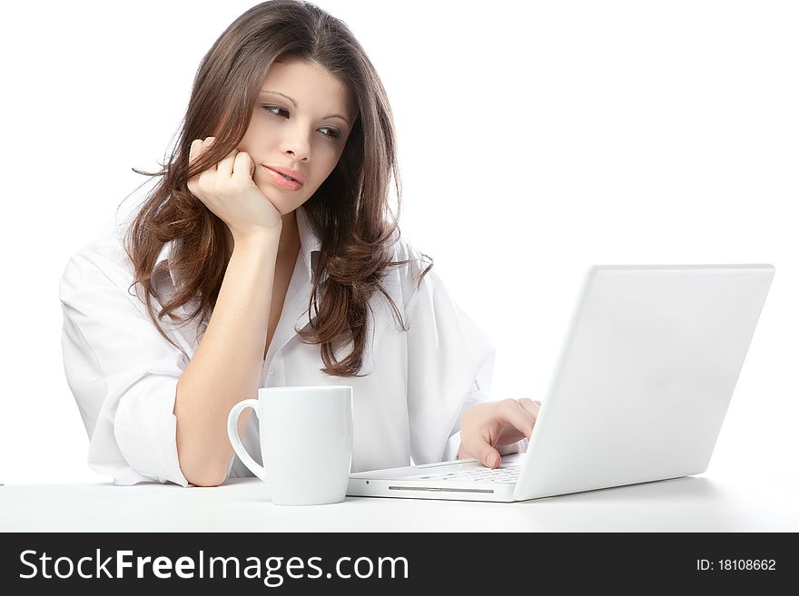 A beautiful young female woman enjoying a cup of tea/coffee. A beautiful young female woman enjoying a cup of tea/coffee