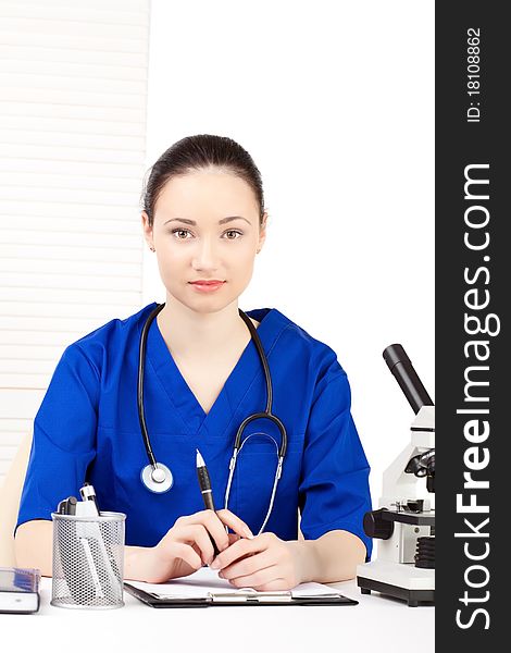 Woman doctor in uniform stay over white background