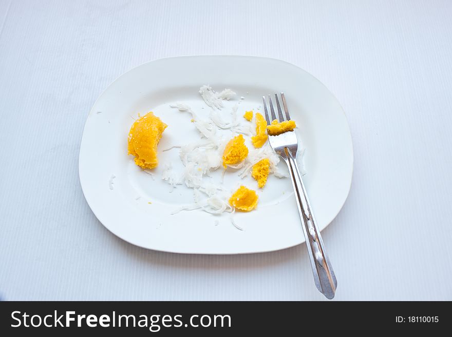 Dessert thai sweet sugar palm cake with coconut  On a white plate