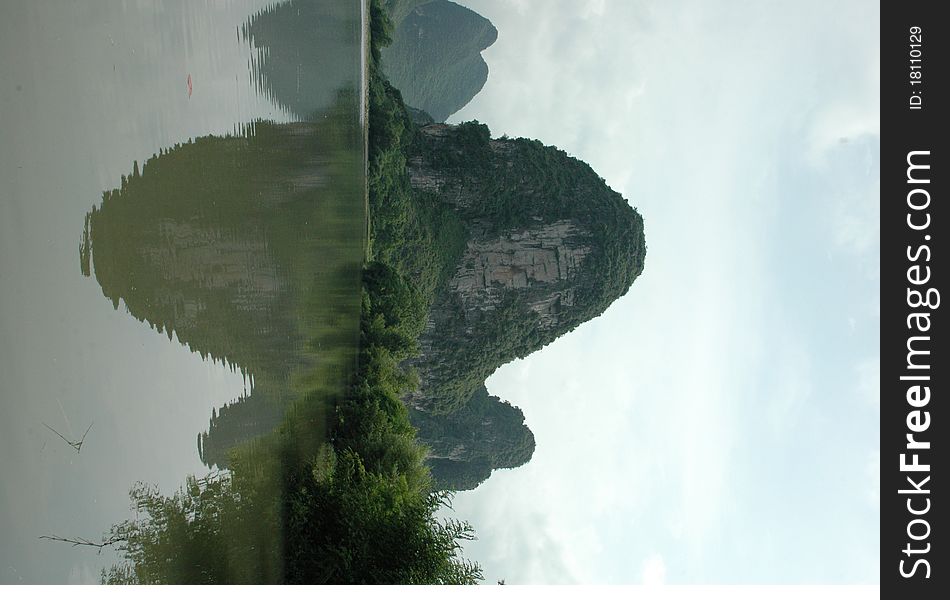 Mountains in China with in reflection in the lake.