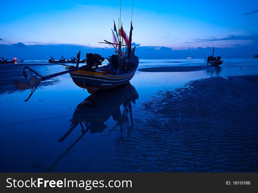 Fisherman boat at twilight time.