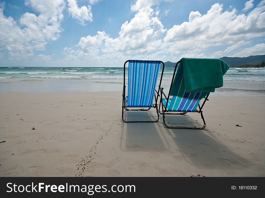 Two beach chairs on the beach. Two beach chairs on the beach.