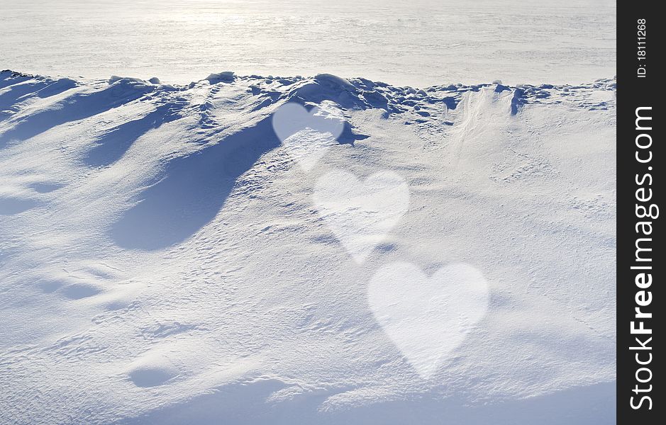 Snow on the land and sunlight, three heart forms. Snow on the land and sunlight, three heart forms.