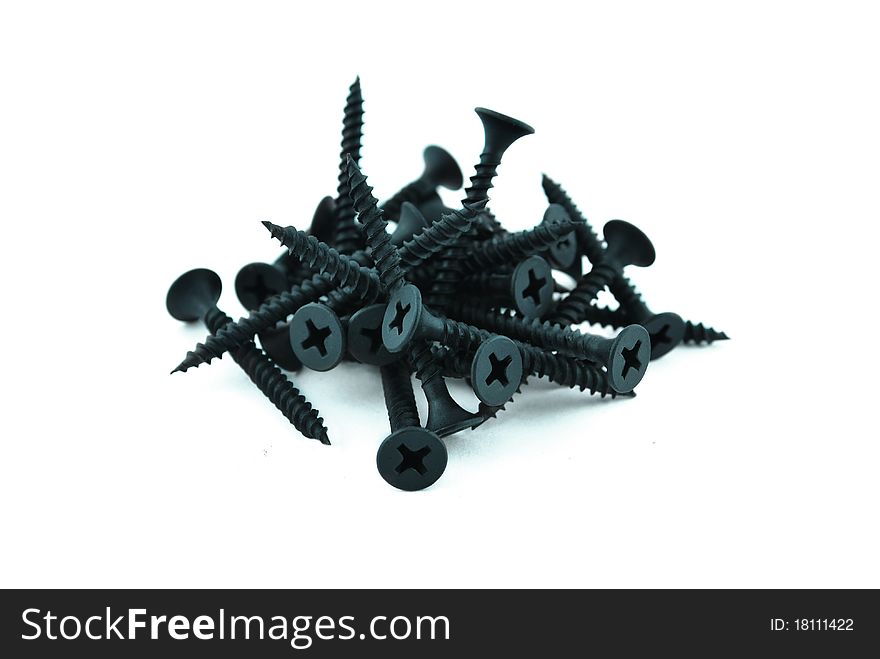 Drywall screws on isolated white background