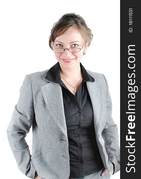 Beautiful young woman posing in business suit and glasses. Isolated over white background.