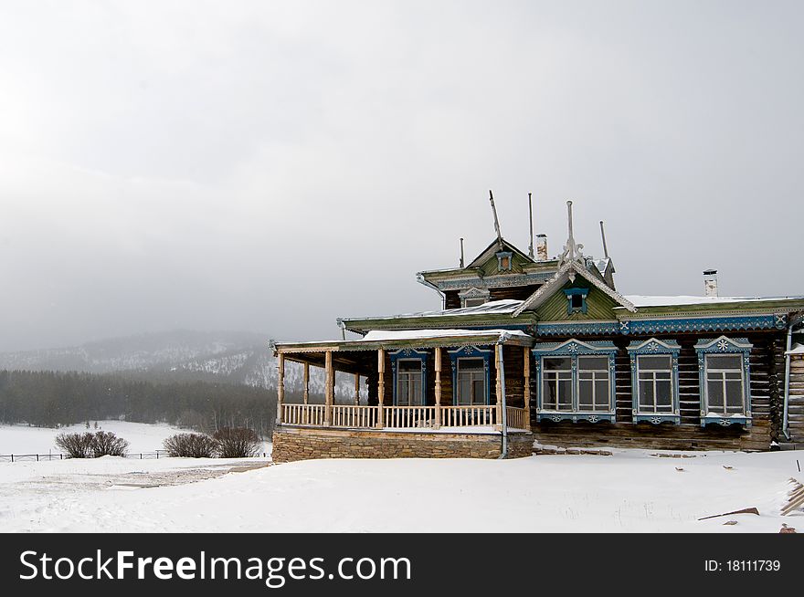 Winter scene in mountains. Old house and snow. Winter scene in mountains. Old house and snow