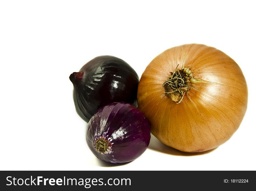 Three onions isolated on a white background