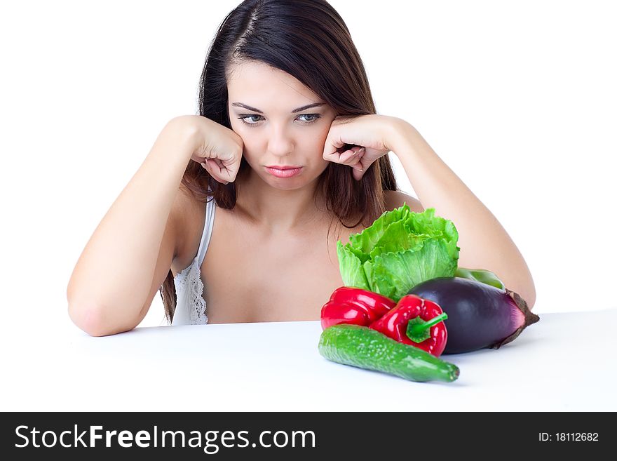 Young girl with vegetables over white background. Young girl with vegetables over white background