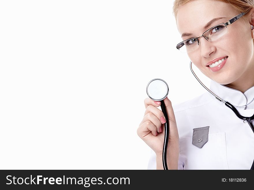 Attractive doctor with a stethoscope on a white background. Attractive doctor with a stethoscope on a white background