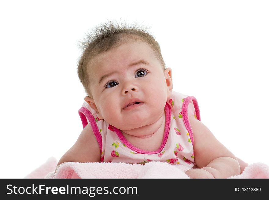 Cute asian-caucasian baby on pink towel looking up, isolated on white background. Cute asian-caucasian baby on pink towel looking up, isolated on white background