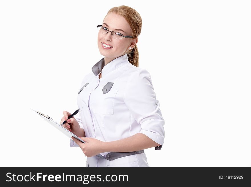A smiling young woman doctor with a white background. A smiling young woman doctor with a white background