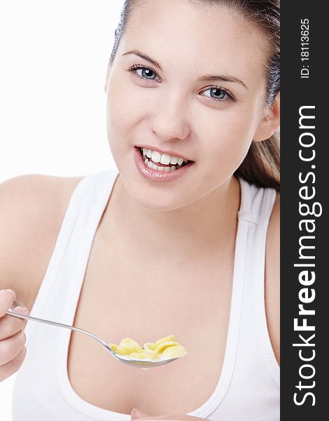 Attractive young girl with corn flakes. Attractive young girl with corn flakes