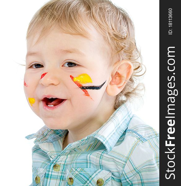 Beautiful baby covered in bright paint with paint brush. Isolated.