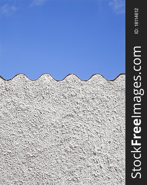 Mediterranean background . White wall against blue sky. Mediterranean background . White wall against blue sky.