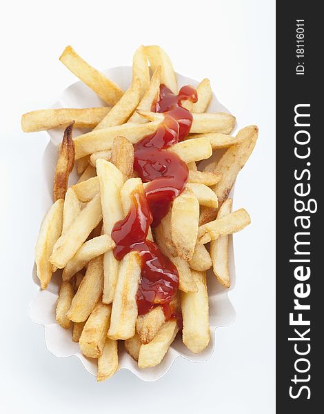 French fries and ketchup on a white background. French fries and ketchup on a white background