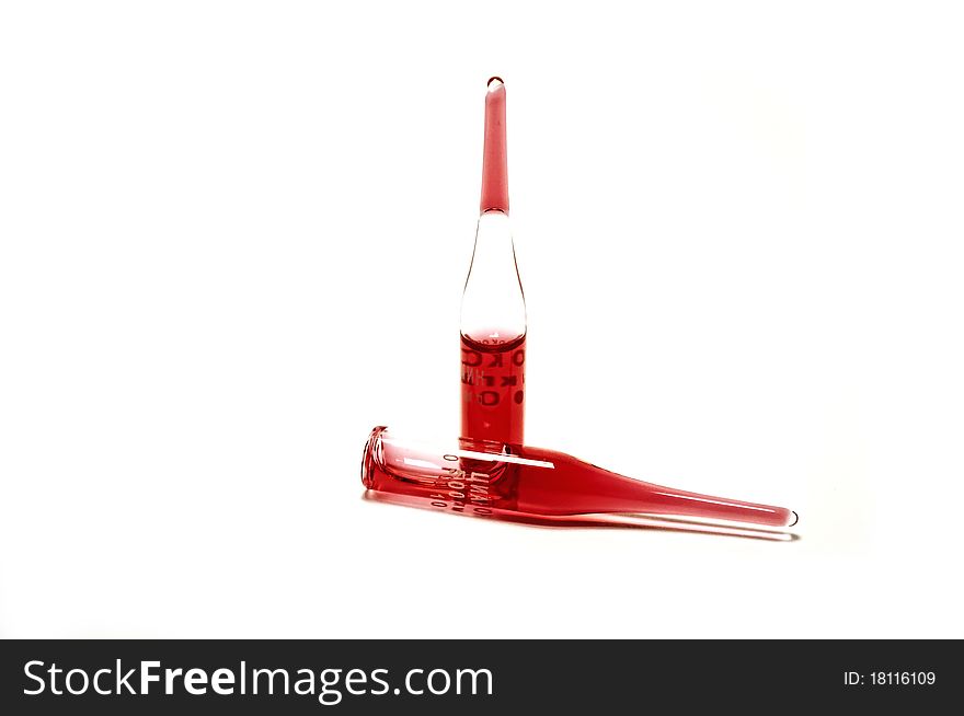 Two flasks with a red liquid on white background. Two flasks with a red liquid on white background