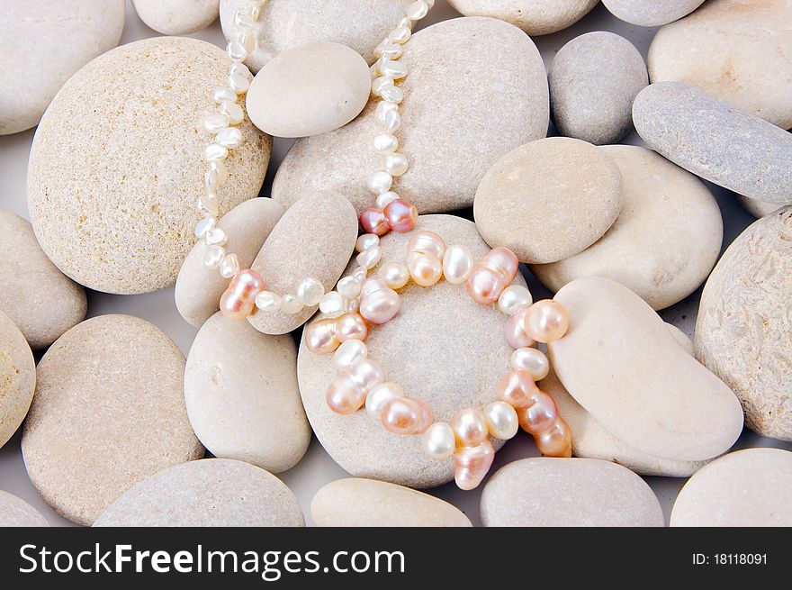 Pearls close up over stone background