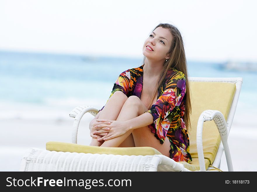 Attractive woman meidtating on sea background