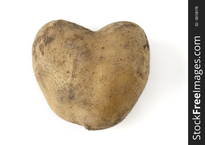 Potatoes in the form of heart on a white background