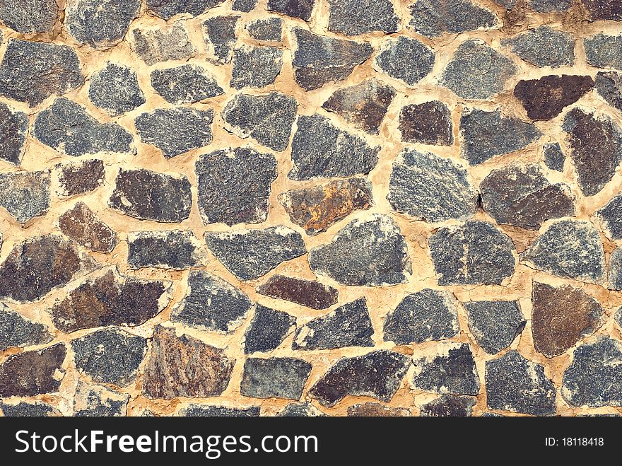 Old beautiful stone wall background. Old beautiful stone wall background
