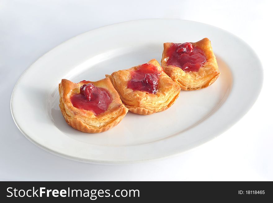 Three pieces of delicious strawberry pies on white background. Three pieces of delicious strawberry pies on white background.