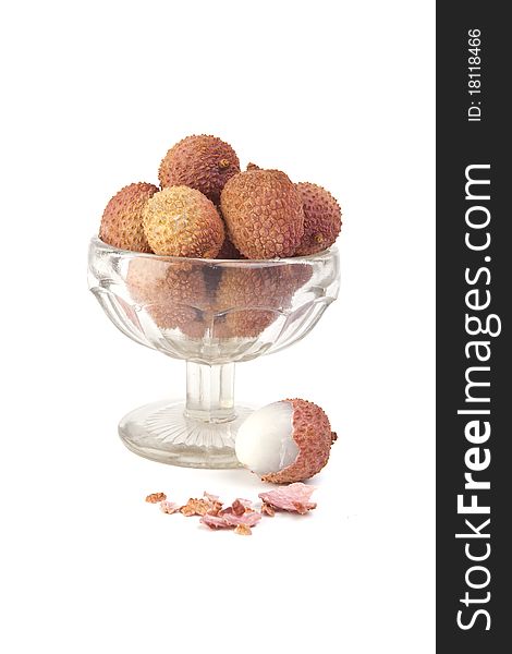 Lychees in glass vase isolated on white background. Lychees in glass vase isolated on white background