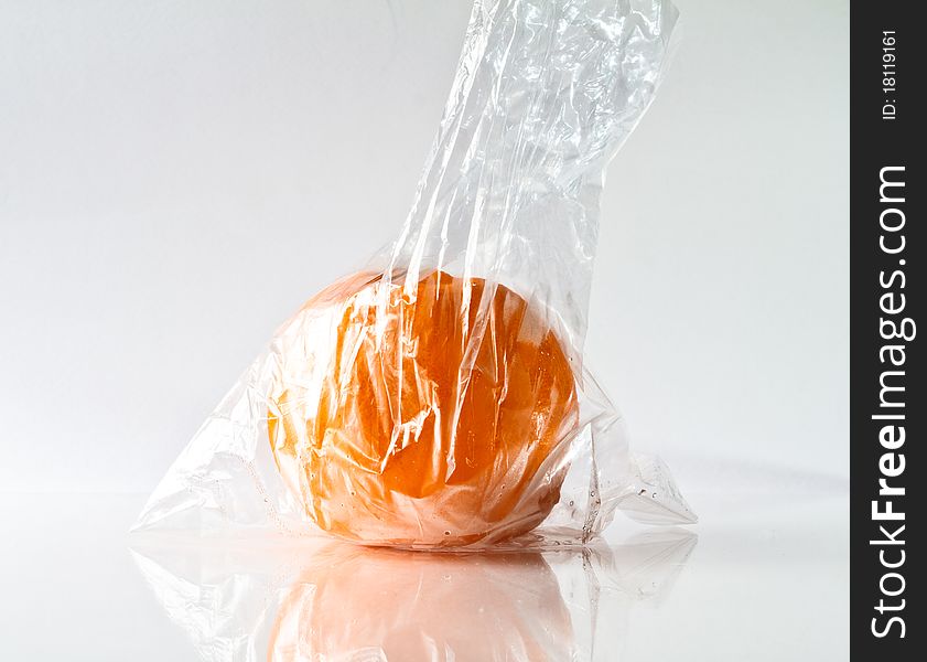 Orange isolated on Glass with Plastic bags.