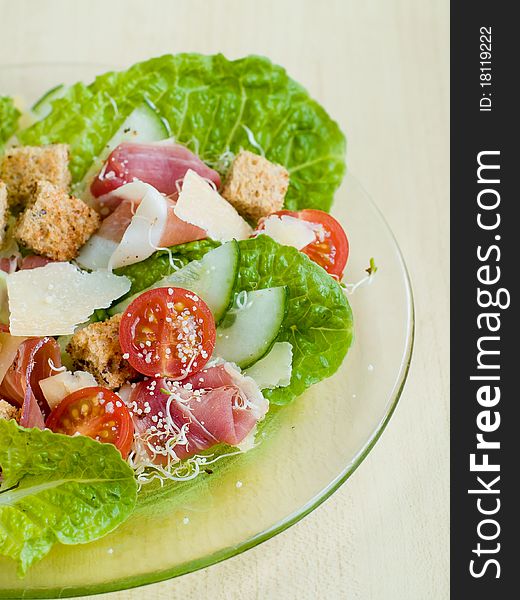 Fresh salad from vegetables, cheese and ham