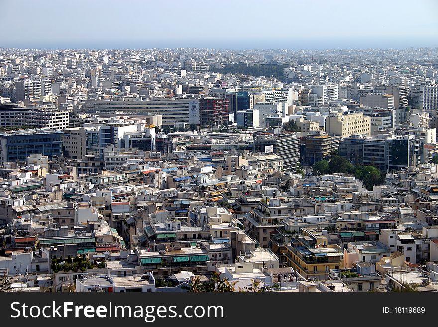 A cityscape of Athens, Greece with the Aegean sea in the background. A cityscape of Athens, Greece with the Aegean sea in the background.