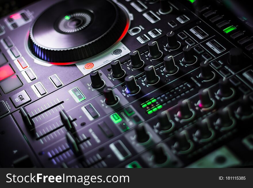 Fancy DJ Conrtoller with plenty of knobs and buttons for live party performance or in music recording studio. Fancy DJ Conrtoller with plenty of knobs and buttons for live party performance or in music recording studio