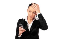 Depressed Businesswoman With Cellphone. Isolated Stock Images Depressed Businesswoman With Cellphone. Isolated Stock Images