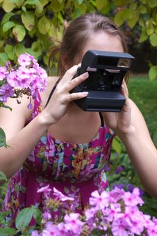 Girl With Old-fashioned Camera Royalty Free Stock Images