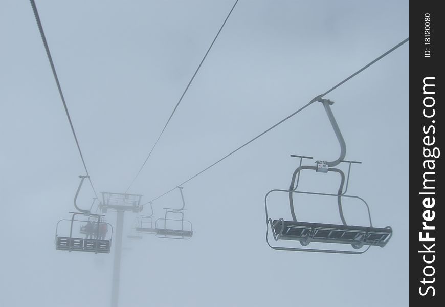Chair lift and foggy weather. Chair lift and foggy weather