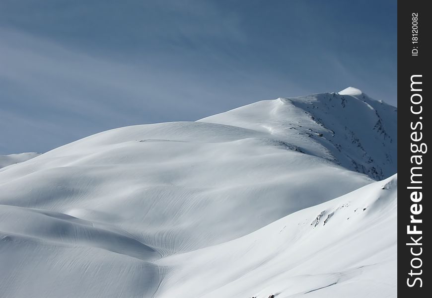 Top of a mountain covered with snow, Savoy alps, France. Top of a mountain covered with snow, Savoy alps, France