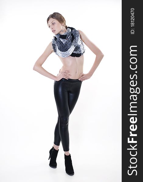 Fashion Model Posing In Leggings And A Scarf