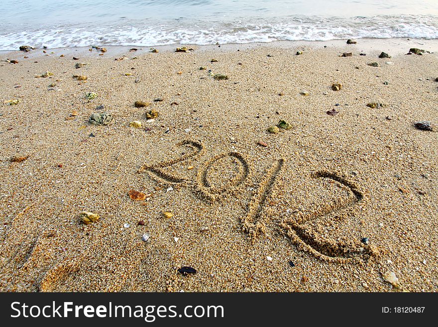 Hand written 2012 on a beach of Hong Kong. Hand written 2012 on a beach of Hong Kong.